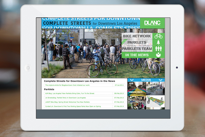 The news page features clippings from articles detailing DLANC's complete street plans and implementation efforts in Downtown LA.